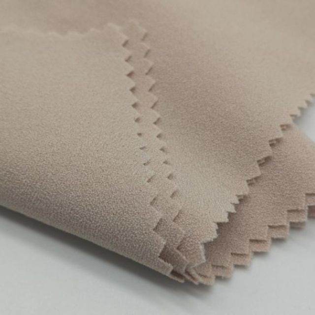 Fashion designer reviewing spandex fabric samples